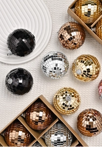 Detailed view of colorful mini disco balls in a box for festive Christmas decoration