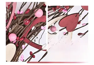 Detail of handmade heart wreath with pink and red berries on realistic wooden branches