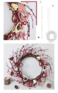 Detailed view of handmade heart-shaped twig wreath with wooden hearts and berries