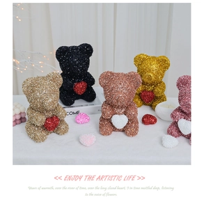 Close-up of glitter-covered foam rose bears with hearts in various metallic colors