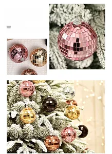 Close-up of sparkling colorful mirror disco balls on a snowy Christmas tree branch