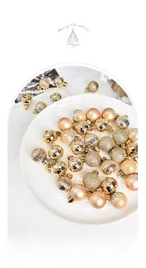 Detailed view of champagne gold Christmas ornaments with matte, glitter and glossy textures