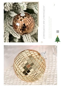 Detail of bronze and gold disco balls with reflective glass tiles on Christmas tree branches