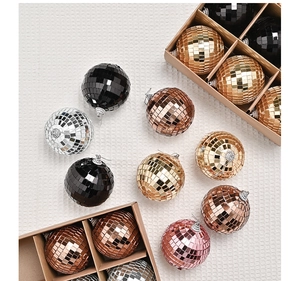 Detailed view of colorful glass mirror disco balls in various shades with hanging loops