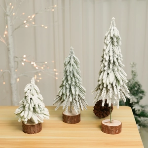 Three-piece frosted pine Christmas trees with natural wood base for table decor