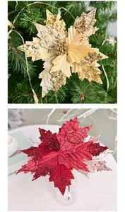 Detailed view of sequins and embroidery on festive red and gold velvet Christmas flowers