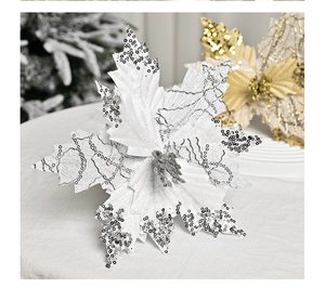 Close-up of silver sequined Christmas poinsettia flower with intricate lace texture