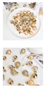 Detail of assorted champagne gold Christmas balls with matte, glitter and glossy textures