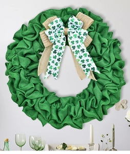 Detail of St. Patrick's Day wreath featuring green burlap layers and shamrock ribbon bow