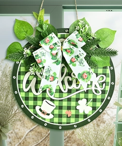 Detail of St. Patrick's Day door wreath with green plaid, shamrocks and lucky gnome bow