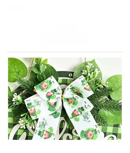 Detail of St. Patrick's Day wreath with green leaves and printed leprechaun ribbon bow