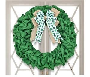 Close-up of St. Patrick's Day clover wreath with green burlap and shamrock ribbon bow