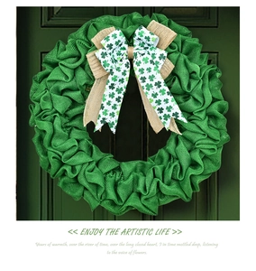 Detail of St. Patrick's Day wreath with green burlap pleats and clover patterns
