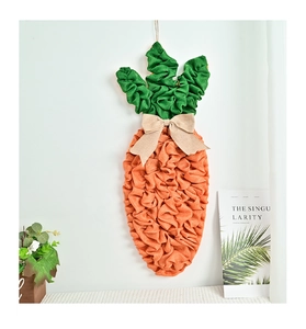 Detailed view of carrot-shaped Easter door hanging made of textured burlap fabric
