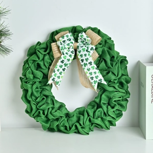 Saint Patrick's Day green burlap wreath with clover bow for festive door decoration