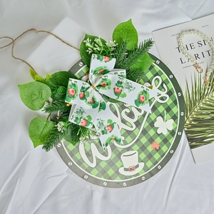 St. Patrick's Day welcome wreath with green plaid, clover bow, and artificial leaves