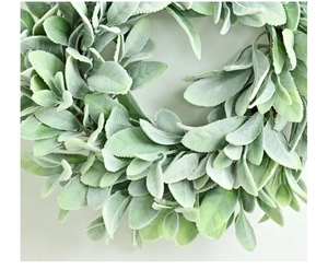 Detailed close-up of soft flocked lamb's ear leaves on a round artificial spring wreath