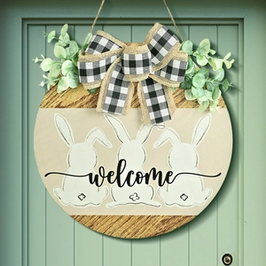 Easter wooden welcome wreath with white rabbits, plaid bow and green leaves on green door