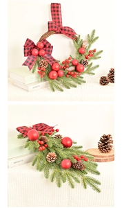 Detail of Christmas wreath and teardrop swag with red berries and pine needles