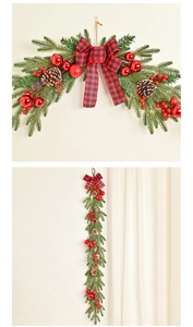Detail of Christmas pine wall swag with red berries, pinecones and plaid bow decoration