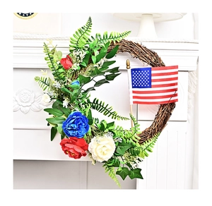 Close-up of Independence Day wreath with red white blue flowers and US flag