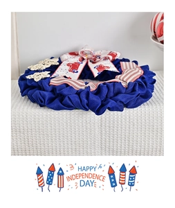 Close-up of Independence Day wreath with blue burlap, bow and rustic star decoration
