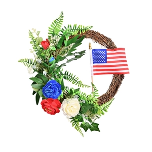 American flag wreath with red white blue flowers and green leaves on rattan ring