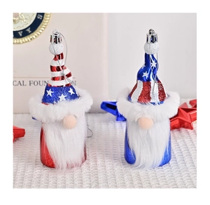 Detail of red and blue Independence Day gnomes with glitter stars and hanging cords