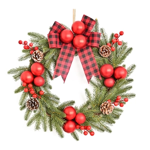 Artificial Christmas pine wreath with red berries, pine cones and buffalo plaid bow
