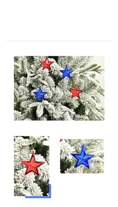 Macro detail of red, blue and silver star ornaments on snowy pine branches