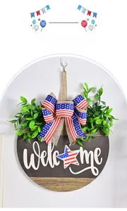 Detail of USA Independence Day welcome sign with burlap bow and artificial greenery
