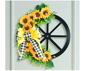 Detail of sunflower wreath with wooden wheel frame and black white plaid ribbon bow