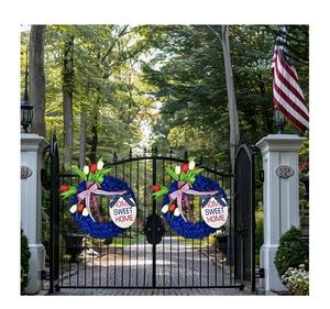 Detail of red and white tulips with Home Sweet Home sign on patriotic wreath