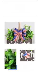 Detail of wooden welcome sign with American flag bow and artificial greenery greenery
