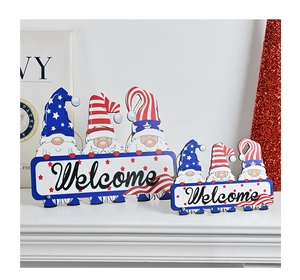 Close-up of American Independence Day wooden gnome welcome sign on a white mantel