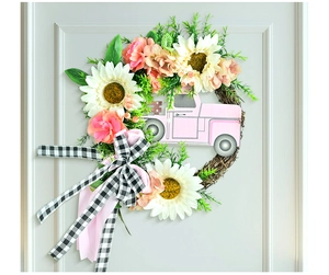 Couronne de fleurs avec camion rose, tournesols et nœud vichy sur base en vigne