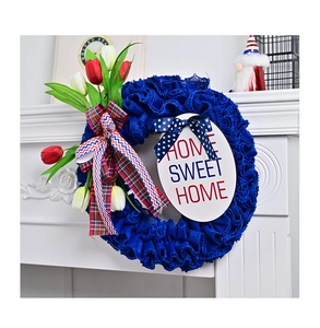 Close-up of burlap Fourth of July wreath with tulips and Home Sweet Home wooden sign