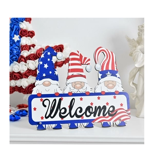 Detail of July 4th gnome welcome wooden sign with stars and stripes festive decoration