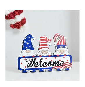 Detail view of Independence Day wood gnome welcome sign with red white and blue patterns
