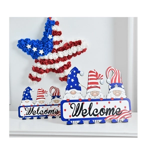 Detail of USA Independence Day wooden gnome welcome signs set on a white mantel