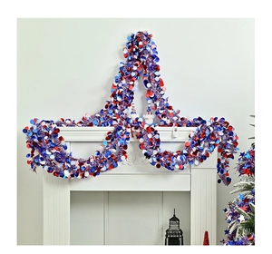 Patriotic red white and blue sequin garland draped on a fireplace for July 4th decor