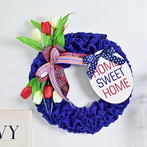 Patriotic wreath with tulips, bows, and Home Sweet Home sign for USA holiday decor