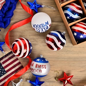 Patriotic Christmas ball ornaments with American flag colors and God Bless America print
