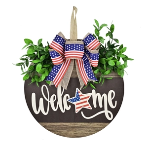 Patriotic wooden Welcome sign with American flag bow and artificial green leaves