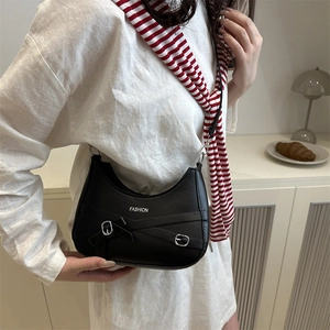 Chic black crescent moon bag with white FASHION lettering and silver buckle straps
