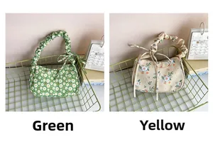 Detail view of floral print armpit bags with ruffled handles in green and yellow