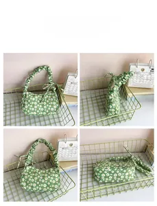 Detail view showing four angles of a light green pleated handbag with daisy floral prints