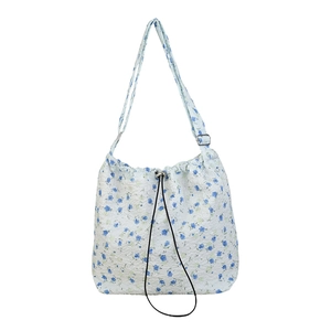 Floral nylon shoulder bag with blue patterns and drawstring closure for summer casual wear