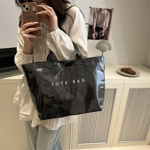 Glossy black tote bag with white TOTE BAG lettering for daily casual or commuting use