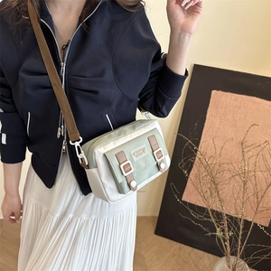 Minimalist Korean canvas crossbody bag with green contrast flap and adjustable strap